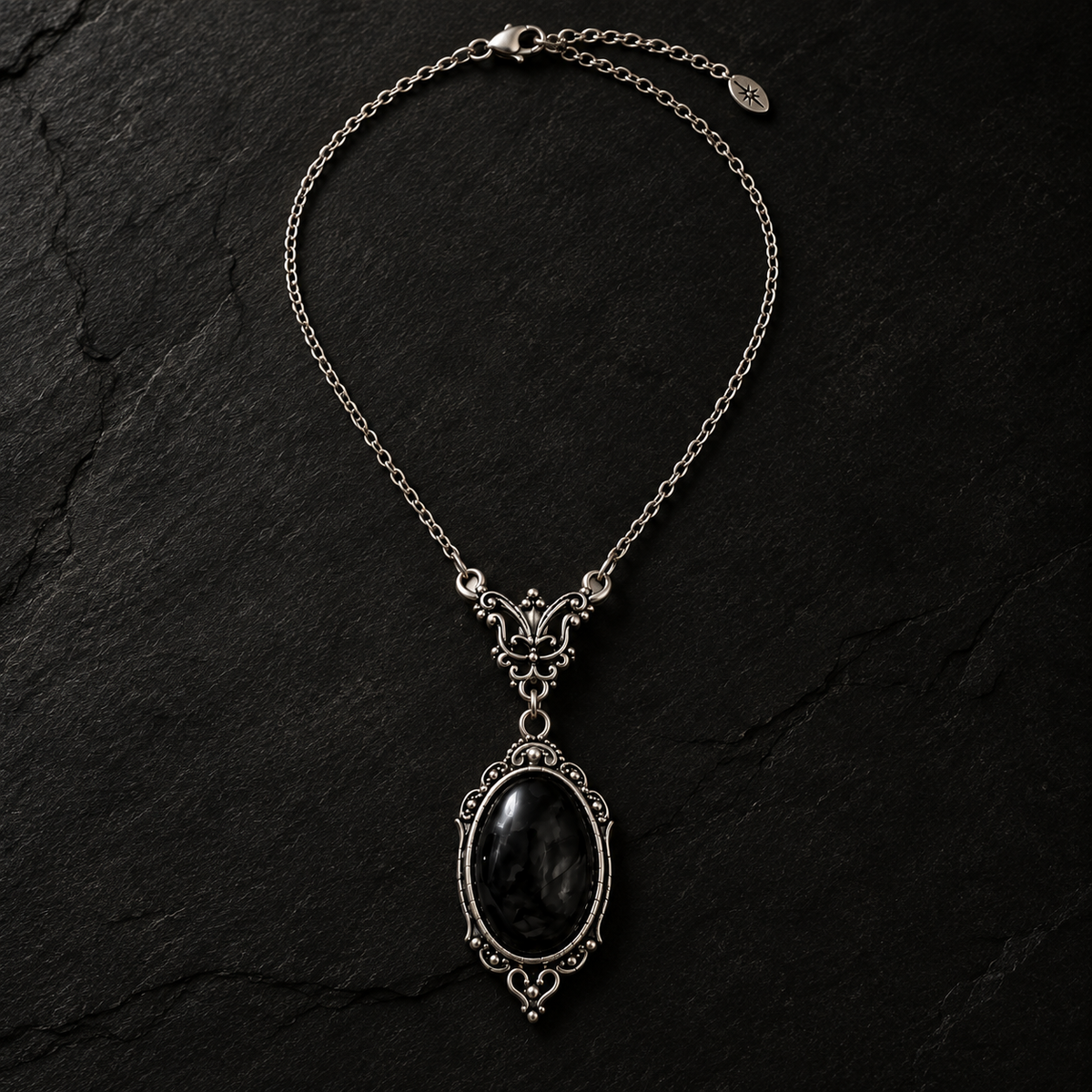Dark aesthetic silver pendant necklace with oval black stone